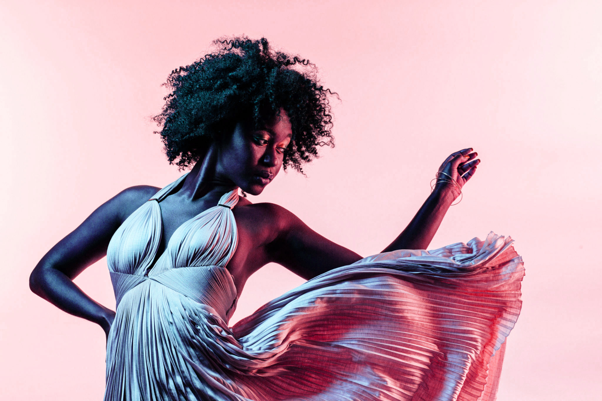 Portrait of a beautiful young black woman, isolated on a studio background